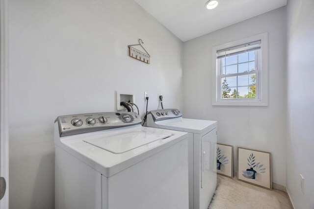 59 Saddle Ln, Levittown, NY 11756 - clothes washing area featuring washer and clothes dryer and light colored carpet