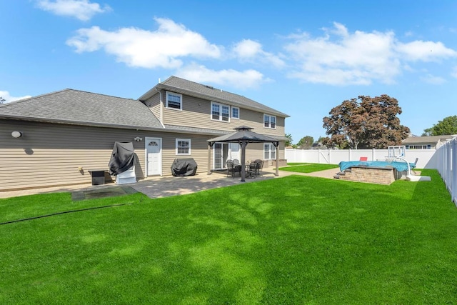 59 Saddle Ln, Levittown, NY 11756 - back of house with a gazebo, a patio, a swimming pool, and a shingled roof