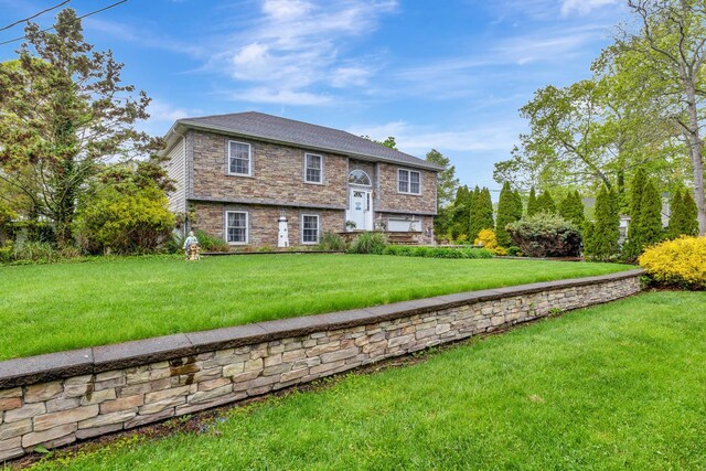 102 Dahlia Dr, Mastic Beach, NY 11951 - raised ranch with stone siding and a front lawn