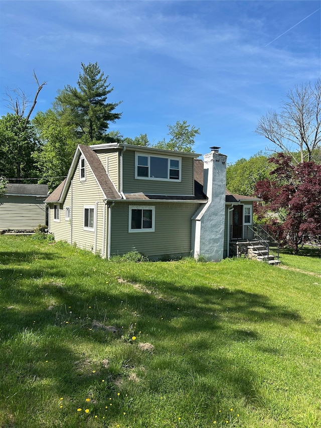 11 Glendale Rd, Greenwood Lake, NY 10925 - back of property with a chimney and a lawn