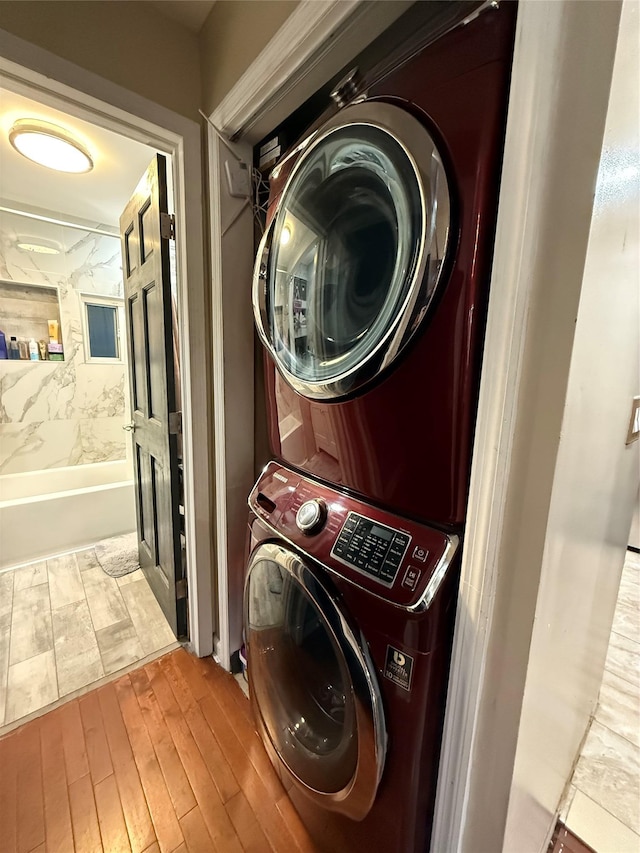 11 Glendale Rd, Greenwood Lake, NY 10925 - laundry room with stacked washer and clothes dryer and wood finished floors
