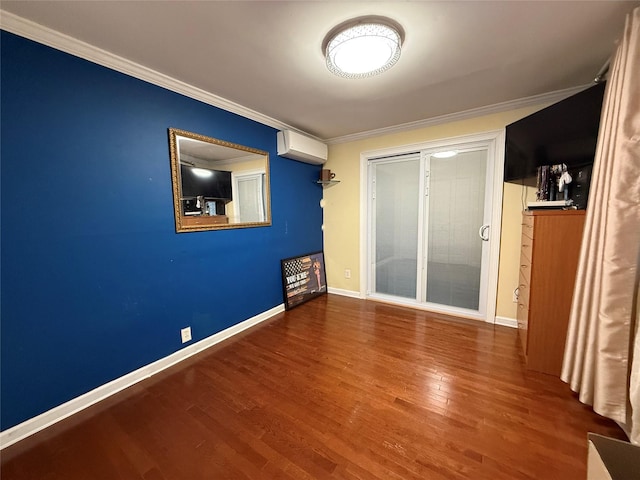 11 Glendale Rd, Greenwood Lake, NY 10925 - unfurnished bedroom featuring crown molding, a wall mounted AC, wood finished floors, and baseboards