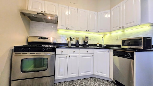 kitchen featuring stainless steel appliances, under cabinet range hood, and white cabinets