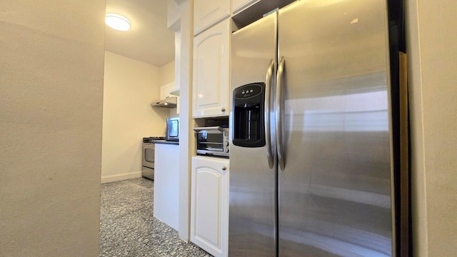 kitchen with stainless steel appliances, white cabinets, and baseboards