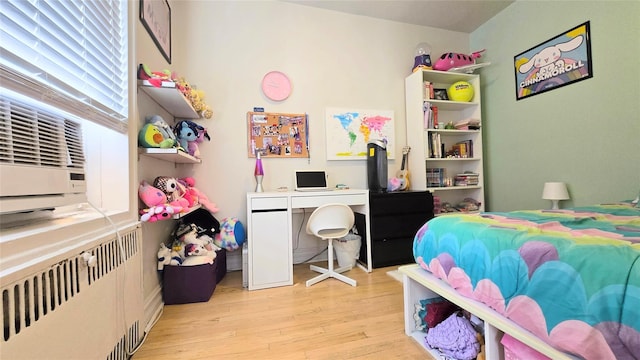 bedroom featuring wood finished floors