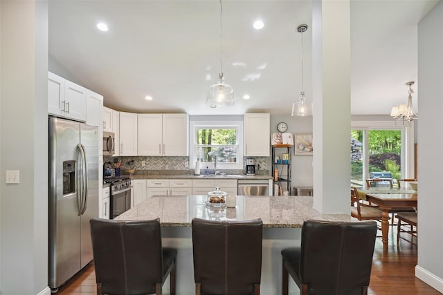 17 Kingswood Way, South Salem, NY 10590 - kitchen featuring stainless steel appliances, backsplash, a sink, light stone countertops, and recessed lighting