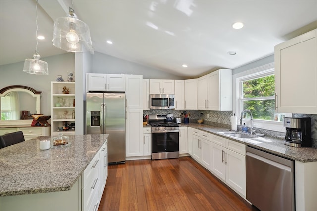 17 Kingswood Way, South Salem, NY 10590 - kitchen featuring stainless steel appliances, a sink, lofted ceiling, light stone counters, and backsplash