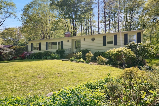17 Kingswood Way, South Salem, NY 10590 - view of front facade featuring a chimney and a front lawn