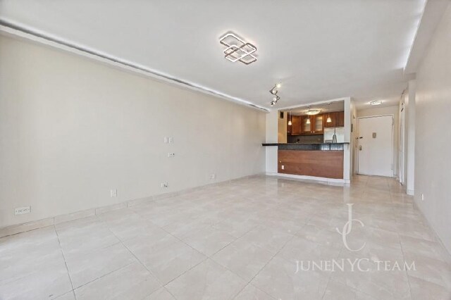 150-38 Union Tpke Unit 4K, Flushing, NY 11367 - unfurnished living room featuring light tile patterned flooring