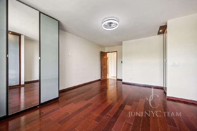 150-38 Union Tpke Unit 4K, Flushing, NY 11367 - empty room with wood finished floors and baseboards