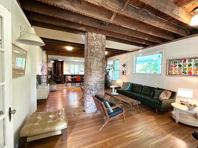 community lobby featuring beamed ceiling