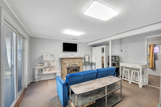 carpeted living area featuring a stone fireplace