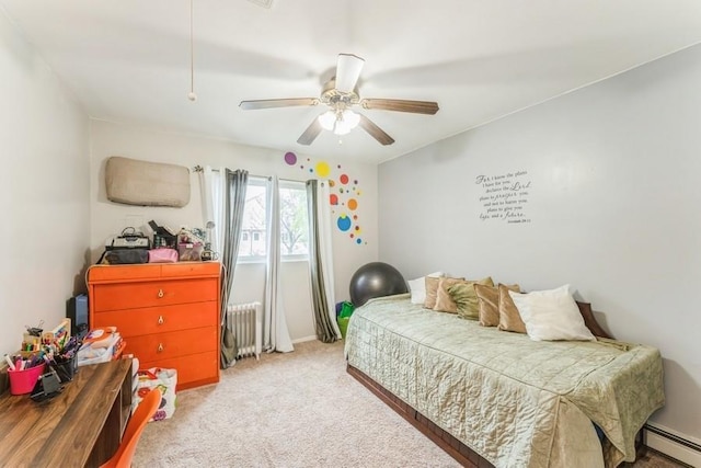 17 Bayview Ct, Inwood, NY 11096 - bedroom with radiator, baseboard heating, light carpet, and a ceiling fan
