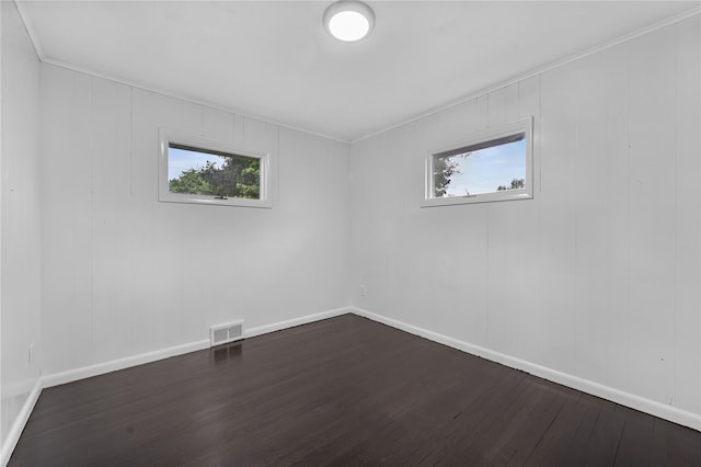 13 Barnett Rd E, Monroe, NY 10950 - unfurnished room with dark wood-style flooring, baseboards, healthy amount of natural light, and crown molding