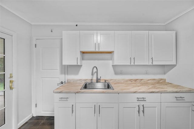 13 Barnett Rd E, Monroe, NY 10950 - kitchen featuring a sink, white cabinetry, light countertops, dark wood-type flooring, and crown molding