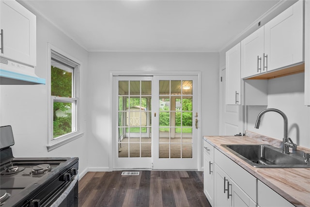 13 Barnett Rd E, Monroe, NY 10950 - kitchen featuring a sink, range with electric stovetop, dark wood-type flooring, white cabinets, and under cabinet range hood
