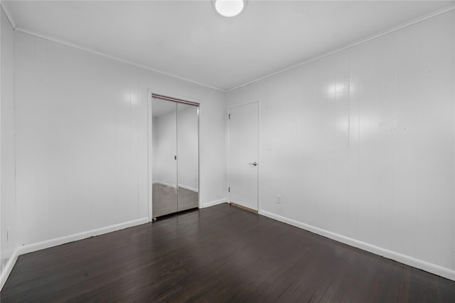 13 Barnett Rd E, Monroe, NY 10950 - unfurnished bedroom featuring dark wood-style floors, baseboards, a closet, and crown molding