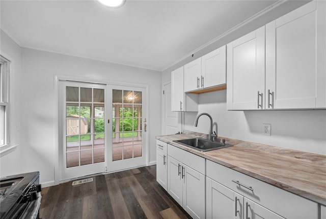 13 Barnett Rd E, Monroe, NY 10950 - kitchen featuring a sink, dark wood finished floors, white cabinets, and baseboards