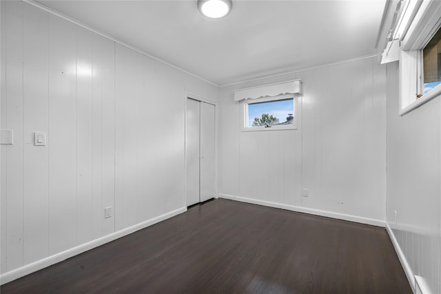 13 Barnett Rd E, Monroe, NY 10950 - below grade area featuring dark wood-type flooring, ornamental molding, and baseboards