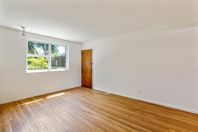 220-29 73rd Ave Lower, Lower, Oakland Gardens, NY 11364 - spare room featuring light wood-style floors and baseboards