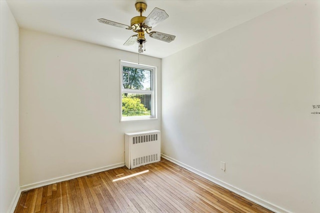 220-29 73rd Ave Lower, Lower, Oakland Gardens, NY 11364 - empty room featuring radiator, ceiling fan, light wood-type flooring, and baseboards