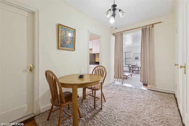 98-50 67th Ave Unit 6F, Rego Park, NY 11365 - dining room featuring baseboards and carpet