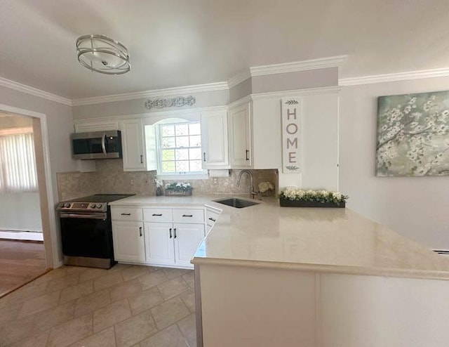 kitchen with a sink, appliances with stainless steel finishes, white cabinetry, backsplash, and crown molding