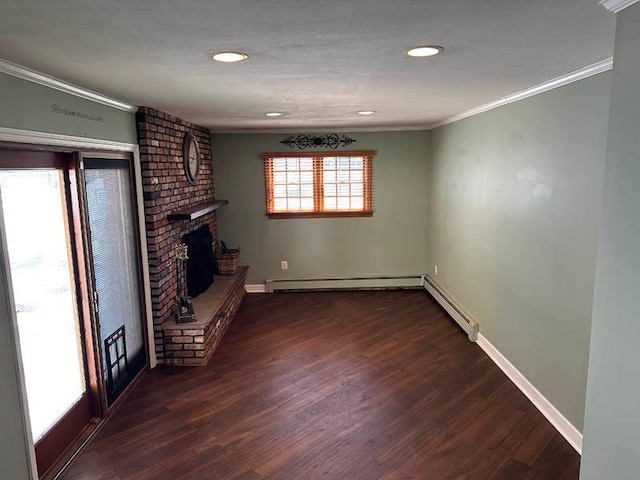 unfurnished living room with crown molding, baseboard heating, dark wood-style floors, a brick fireplace, and baseboards