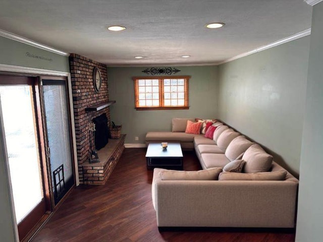 899 E Meadow Ave, North Bellmore, NY 11710 - living room with ornamental molding, dark wood-type flooring, baseboards, a brick fireplace, and recessed lighting