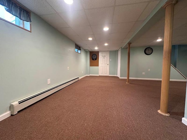 899 E Meadow Ave, North Bellmore, NY 11710 - basement with a baseboard radiator, dark carpet, a paneled ceiling, baseboards, and recessed lighting