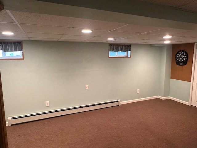 899 E Meadow Ave, North Bellmore, NY 11710 - basement featuring a baseboard heating unit, dark colored carpet, a paneled ceiling, baseboards, and recessed lighting