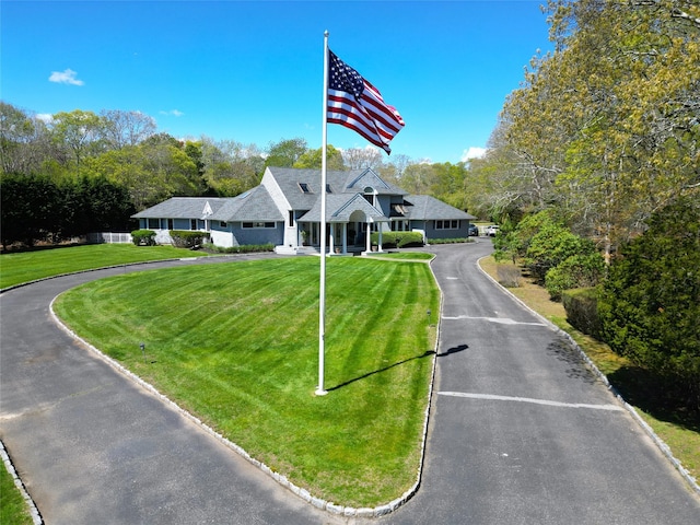124 Montauk Hwy, Westhampton, NY 11977 - view of front of house with a front yard and asphalt driveway