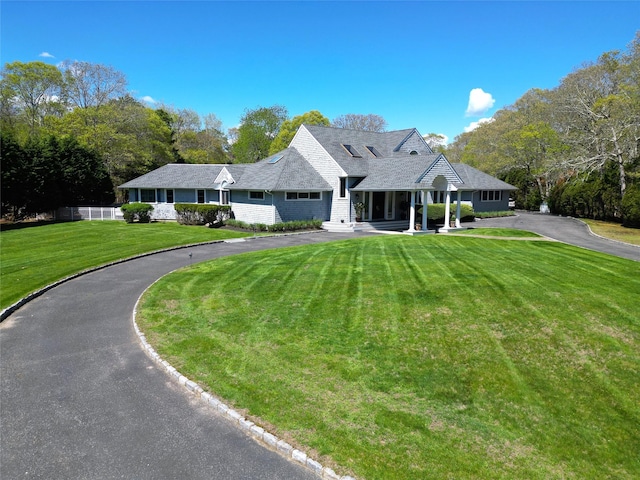 124 Montauk Hwy, Westhampton, NY 11977 - view of front of house with a front lawn and driveway
