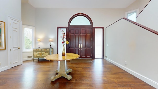 124 Montauk Hwy, Westhampton, NY 11977 - foyer with dark wood-style floors, baseboards, and a high ceiling