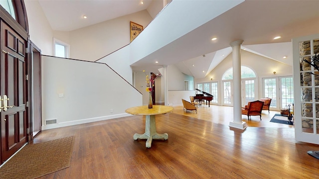 124 Montauk Hwy, Westhampton, NY 11977 - foyer entrance featuring decorative columns, high vaulted ceiling, recessed lighting, wood finished floors, and baseboards