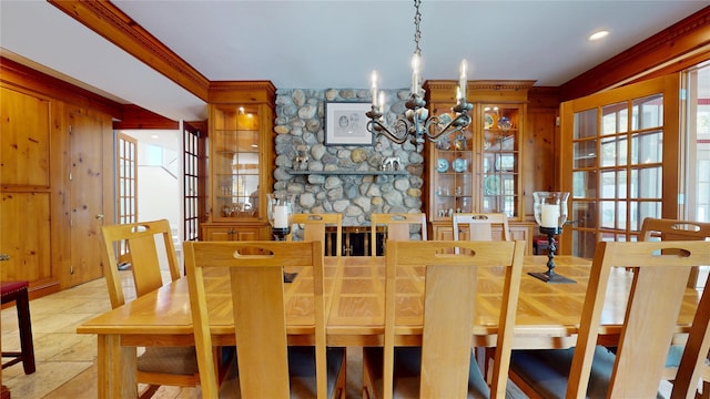 124 Montauk Hwy, Westhampton, NY 11977 - dining area featuring a chandelier, plenty of natural light, and ornamental molding