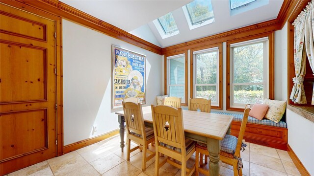 124 Montauk Hwy, Westhampton, NY 11977 - dining room with a skylight, baseboards, and lofted ceiling