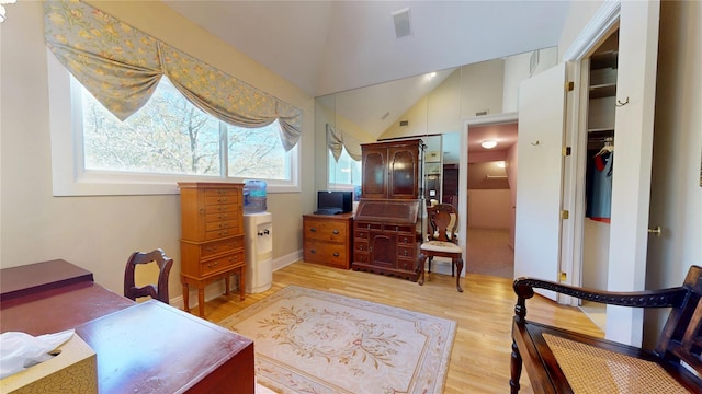 124 Montauk Hwy, Westhampton, NY 11977 - bedroom featuring lofted ceiling, light wood-style flooring, and an office area