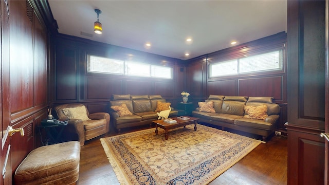 124 Montauk Hwy, Westhampton, NY 11977 - living room with dark wood-style floors, a decorative wall, and recessed lighting