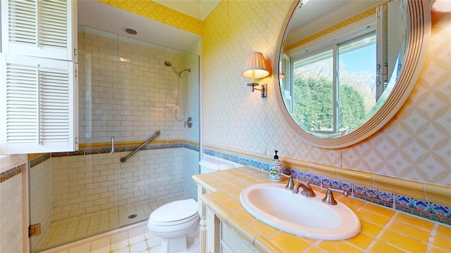 124 Montauk Hwy, Westhampton, NY 11977 - bathroom featuring wallpapered walls, a stall shower, toilet, vanity, and ornamental molding