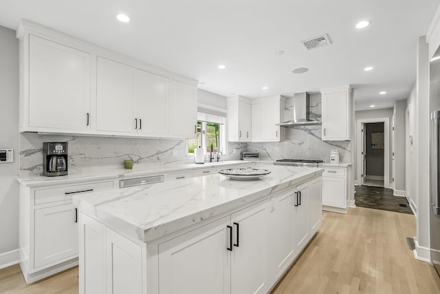 92 Random Farms Dr, Chappaqua, NY 10514 - kitchen featuring wall chimney exhaust hood, light wood-type flooring, backsplash, white cabinets, and recessed lighting