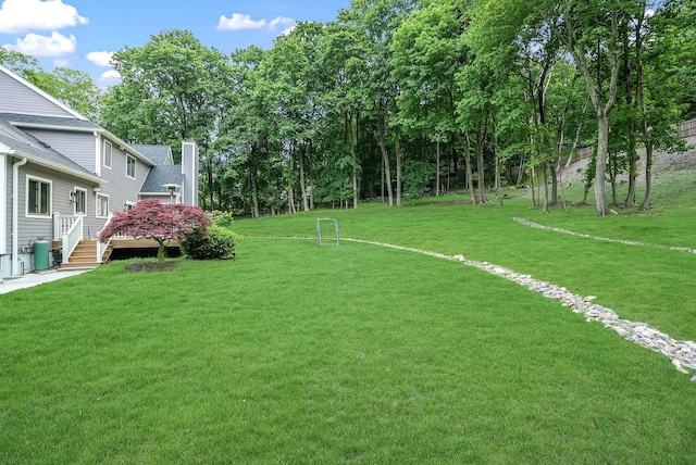 92 Random Farms Dr, Chappaqua, NY 10514 - view of grassy yard featuring central AC and a deck