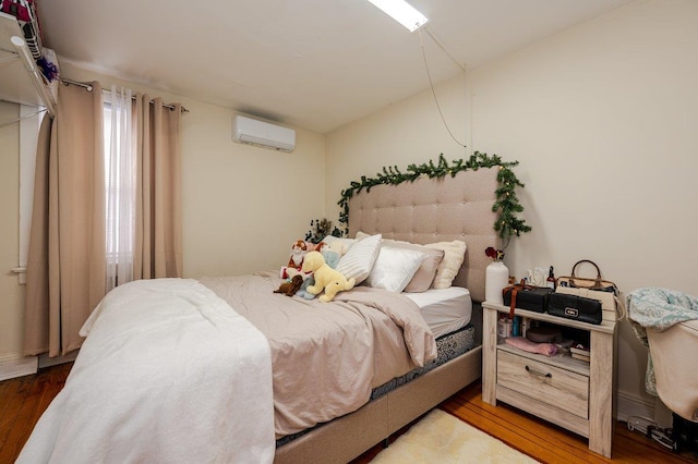31 Thurman St, Yonkers, NY 10701 - bedroom featuring a wall unit AC and wood finished floors