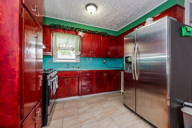 31 Thurman St, Yonkers, NY 10701 - kitchen featuring appliances with stainless steel finishes, reddish brown cabinets, a sink, light countertops, and a textured ceiling