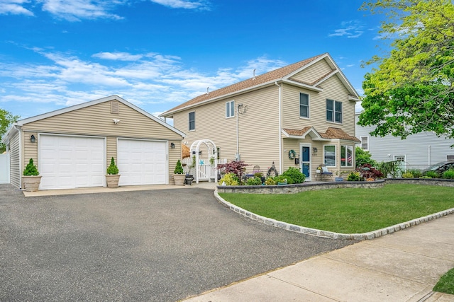510 Fire Island Ave, Babylon, NY 11702 - traditional-style home with an outbuilding, a front lawn, and a garage