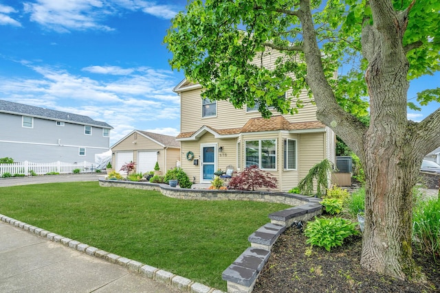 510 Fire Island Ave, Babylon, NY 11702 - view of front of home featuring a detached garage and asphalt driveway