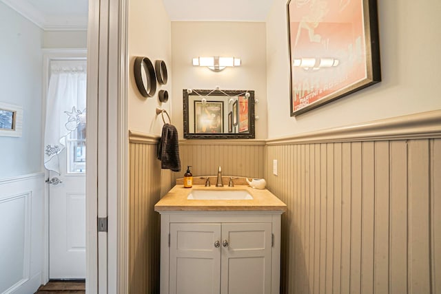 510 Fire Island Ave, Babylon, NY 11702 - bathroom with a wainscoted wall, vanity, and ornamental molding