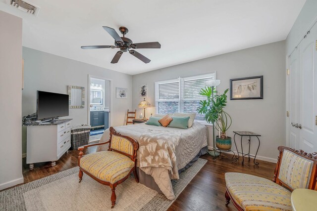 510 Fire Island Ave, Babylon, NY 11702 - bedroom featuring baseboards, dark wood-style floors, a ceiling fan, ensuite bathroom, and a closet