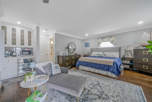 510 Fire Island Ave, Babylon, NY 11702 - bedroom featuring beverage cooler, wood finished floors, ornamental molding, recessed lighting, and bar area