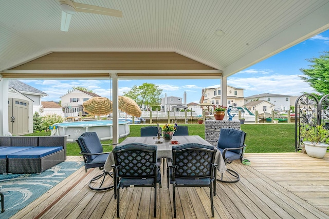 510 Fire Island Ave, Babylon, NY 11702 - wooden terrace with ceiling fan, outdoor dining area, a lawn, and a residential view